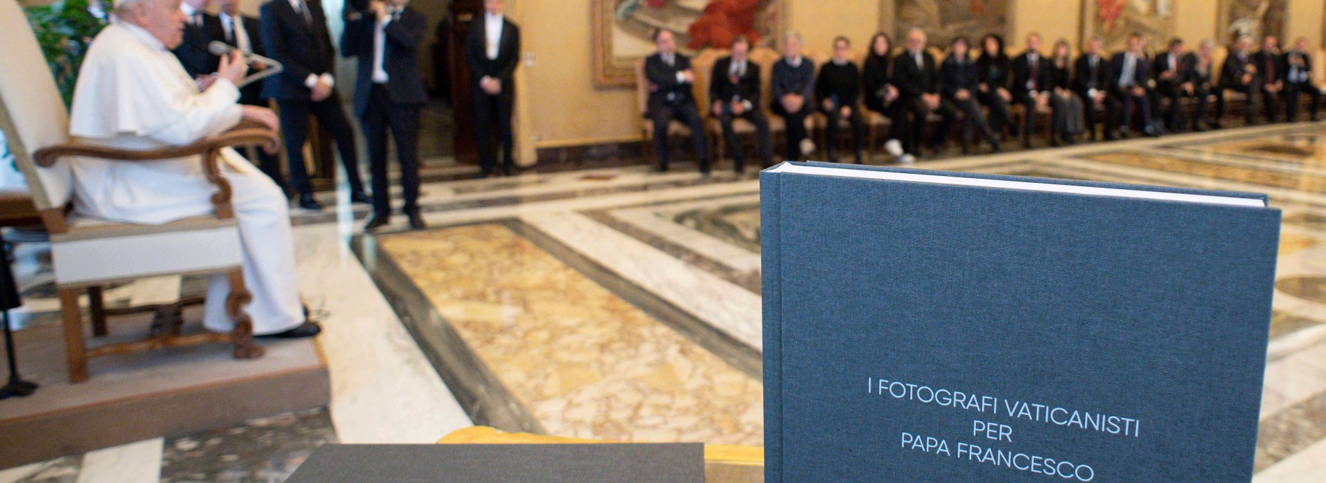 Pope Francis in a private audience with Vatican photographers