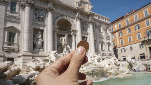 Trevi Fountain Rome tourist coin hope luck