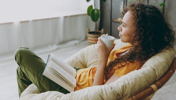 woman tea sun read book plant