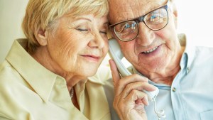 Elderly couple on phone