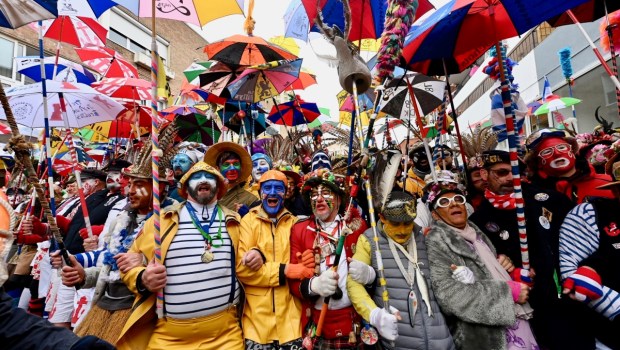A group of fishermen in colorful costumes celebrate Mardi Gras in Dunkirk, Northern France