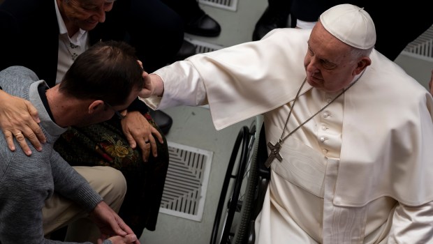 Pope Francis blesses the faithful at the end of his weekly general audience in Paul VI Hall