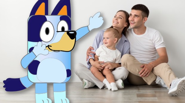 Family looking at animated character "Bluey" from kids' TV show