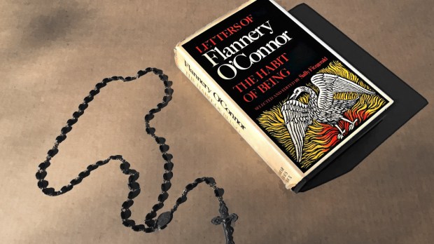 Flannery O'Connor book "The Habit of Being" on table with rosary