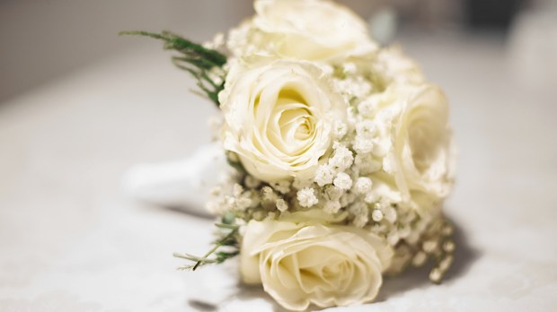 White rose bridal bouquet on table