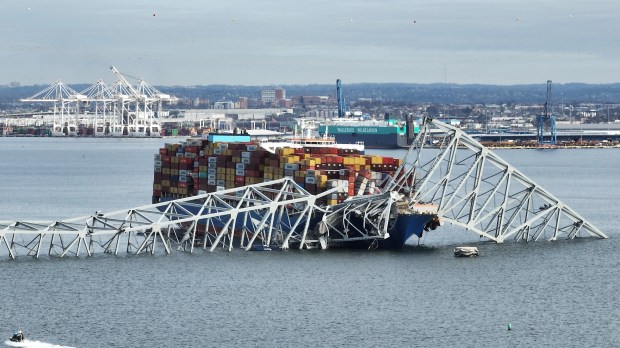 Francis Scott Key Bridge sits on top of a container ship after the bridge collapsed, Baltimore, Maryland