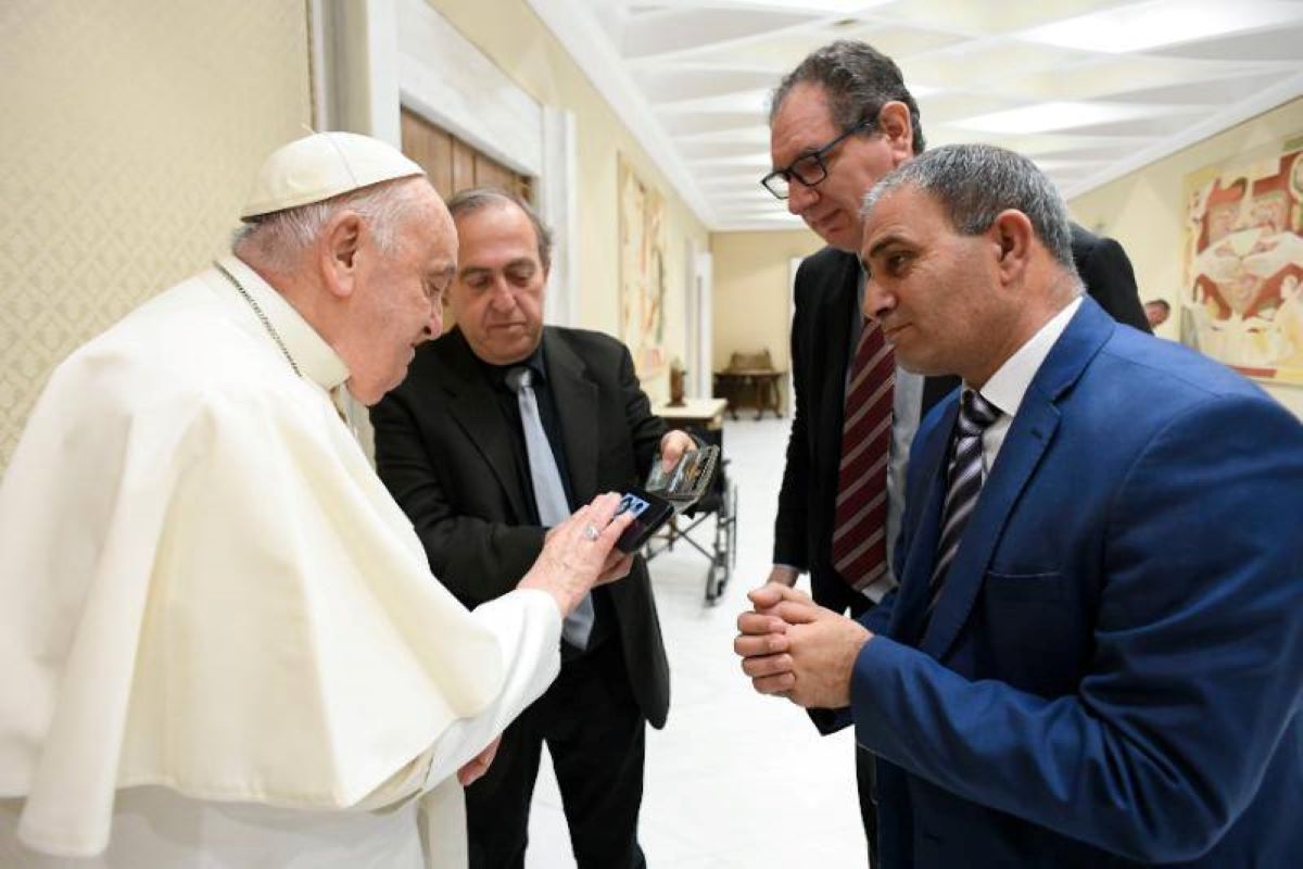 Rami Elhanan and Bassam Aramin, Israeli and Palestinian dads and peace activists, meet Pope Francis before the general audience on March 27, 2024.