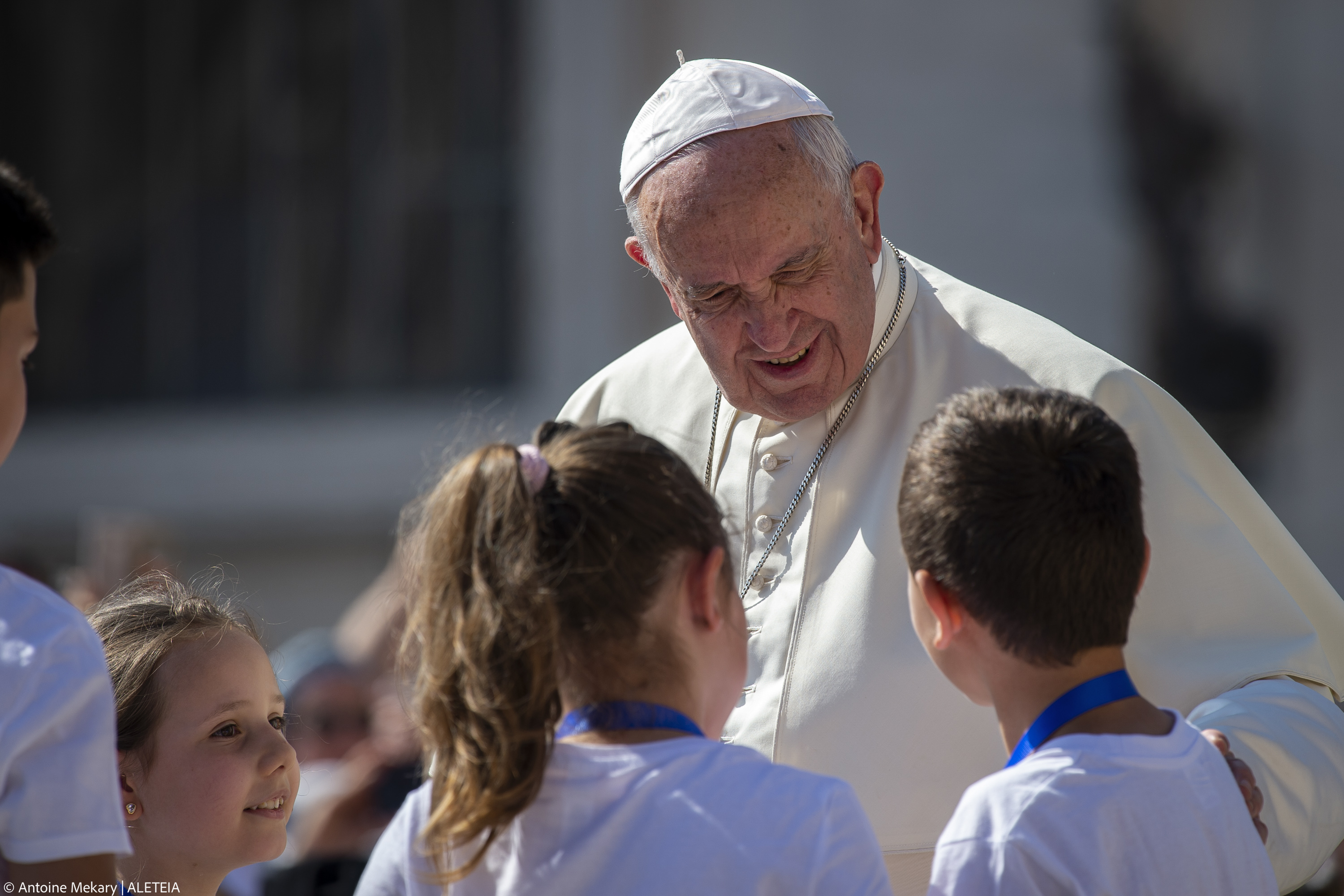 Pope Francis meets children as he arrives for his weekly general audience in St. Peter's Square at the Vatican