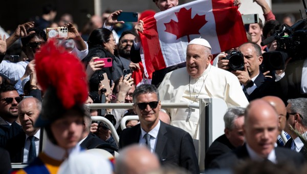 Pope Francis greets the crowd from the popemobile at the end of the Palm Sunday mass at St Peter's square in the Vatican on March 24, 2024