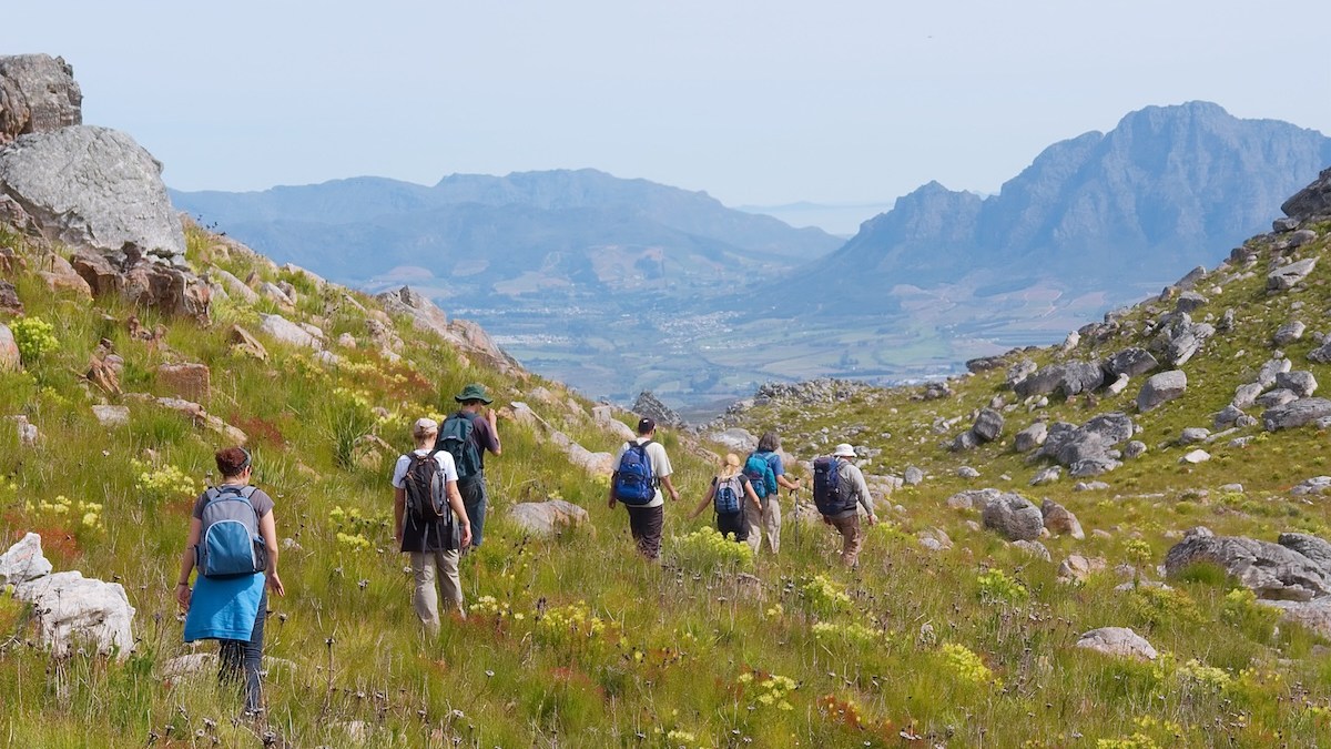 Young adults hiking through the mountains