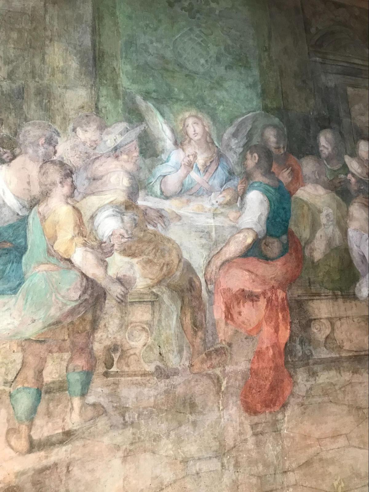 Fresco of an angel sitting at Pope St. Gregory's "Table of the Poor"