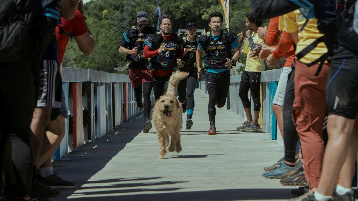 Simu Lui as Leo, Nathalie Emmanuel as Olivia, Mark Wahlberg as Michael, and Ali Suliman as Chik in Arthur the King