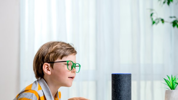 Young boy smart speaker