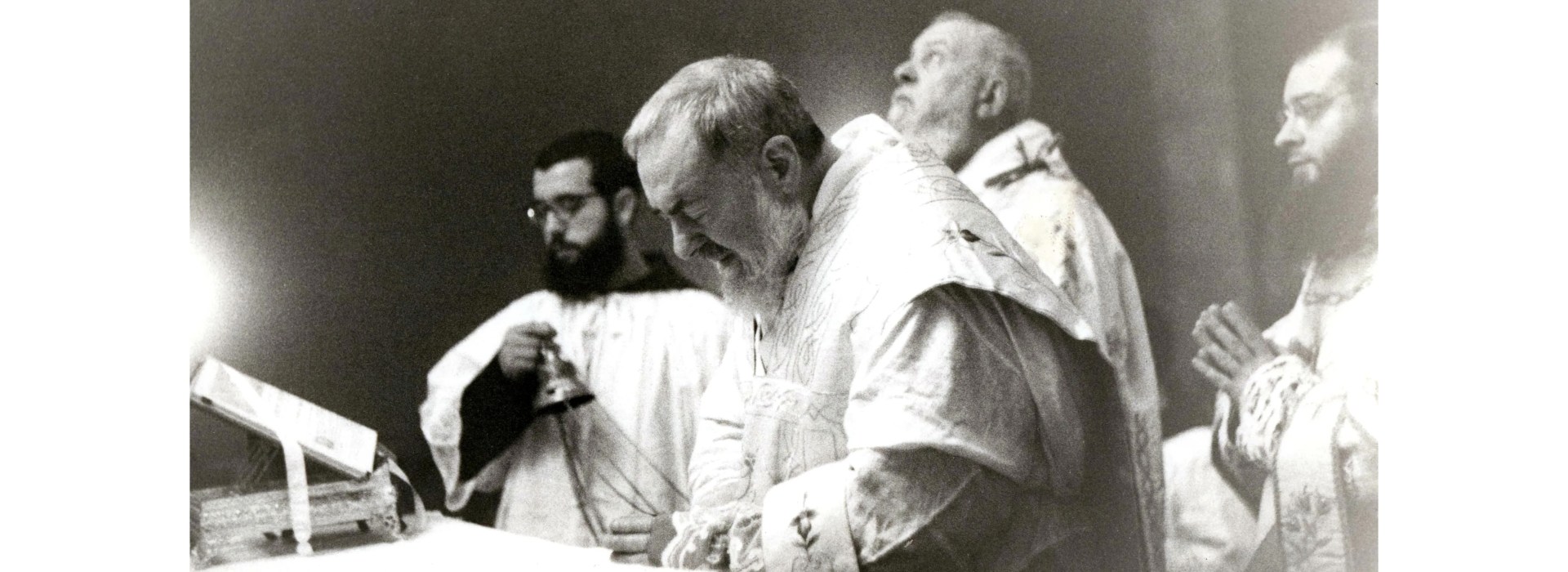 Black and white photo of Padre Pio celebrating Mass, taken by Elia Stelluto, published by the Saint Pio Foundation