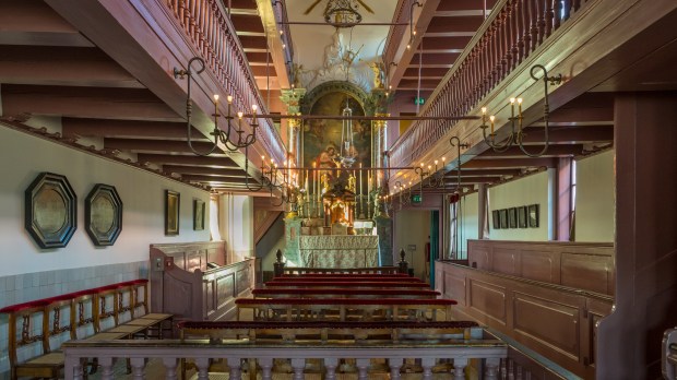 AMSTERDAM-NETHERLANDS-MARCH-19-2018-Ons-Lieve-Heer-op-Solder-Our-Lord-in-the-Attic-a-secret-house-Church-spanning-three-townhouses-in-Amsterdam-Netherlands-Holland.-.jpeg