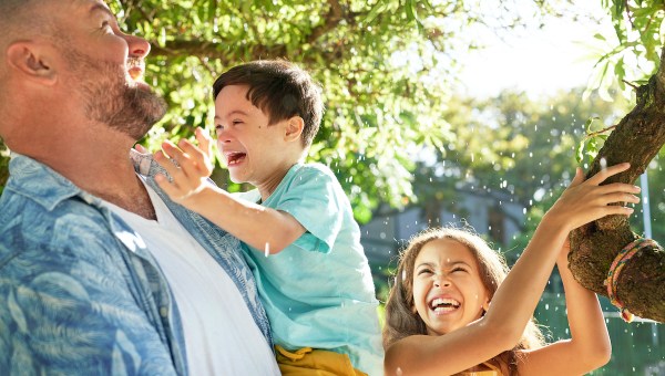 Father holds Down syndrome son