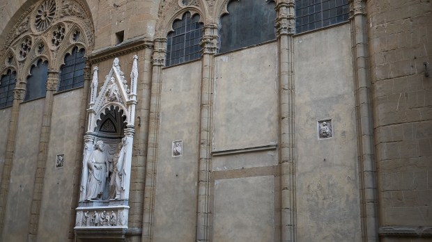 Florence-Italy-February-27-2019-View-of-Orsanmichele-church-Four-Crowned-Martyrs-statue-.jpeg