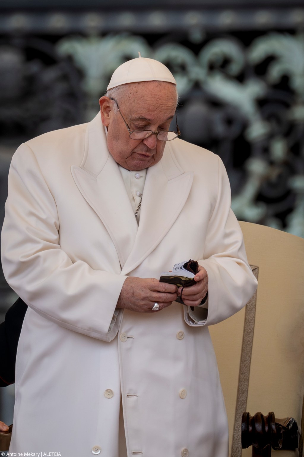 Pope Francis holds a small new Testament from a 23 year old soldier which died in Ukraine