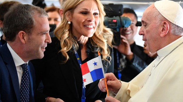 Pope Francis receives a Panamanian flag from journalists Javier Martinez-Brocal