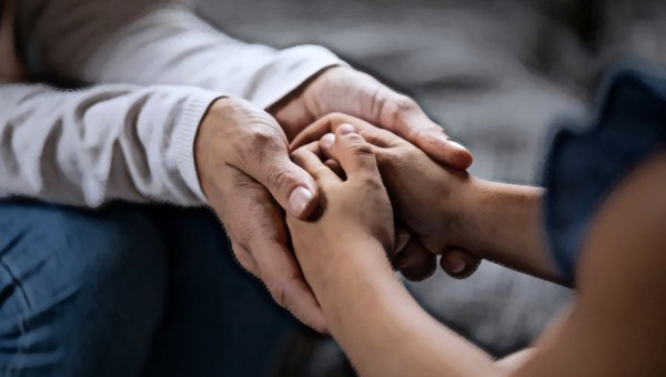 Dad holding child's hand
