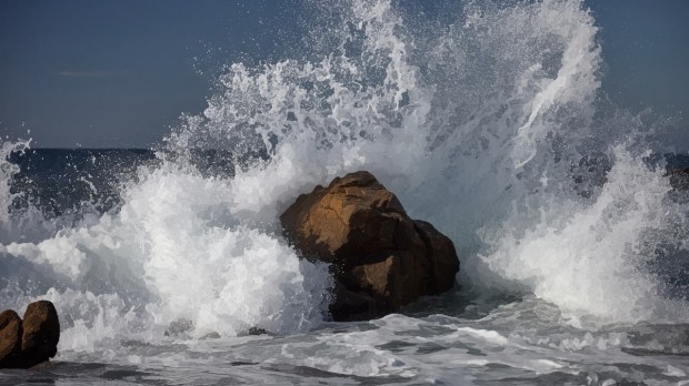 Waves crashing into rocks