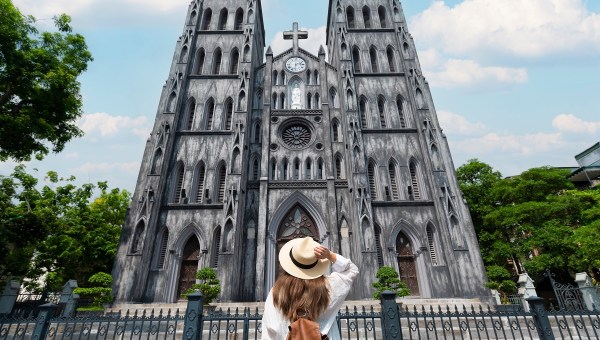 Young woman admires vietnamese church