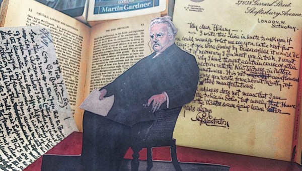 Chesterton posed in front of papers