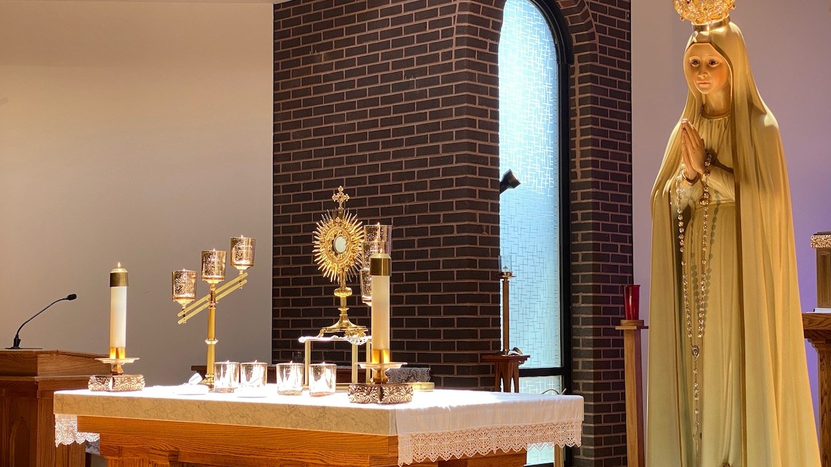 Monstrance on altar with Our Lady of Fatima near