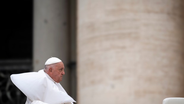 A gust of wind lifts Pope Francis mantilla during the weekly general audience on June 19, 2024 at St Peter's square in The Vatican
