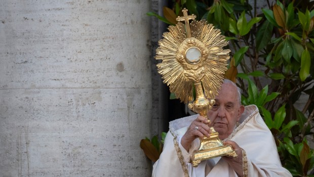 Pope Francis holds the monstrance at Saint Mary Major basilica after a procession and a holy mass for the Solemnity of the Most Holy Body and Blood of Christ (Corpus Christi), on June 2, 2024 in Rome.