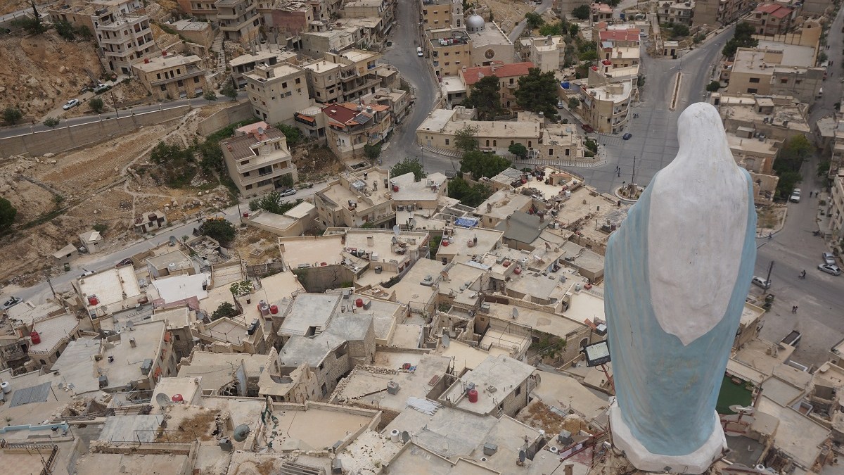Statue of the Blessed Mother watches over Maaloula, Syria