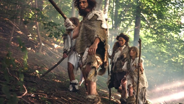 Family of Neanderthals in forest