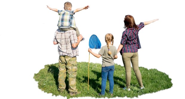 Friendly family outdoors on hike pausing to enjoy view