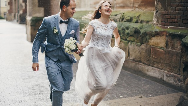 Couple running rain
