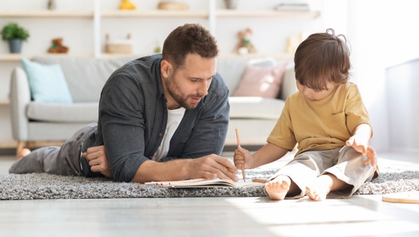 father child writing