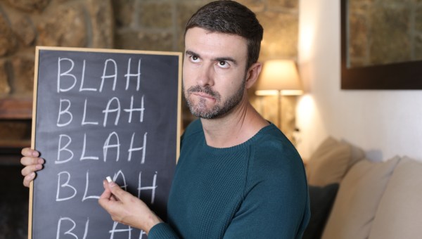 Man holding blackboard