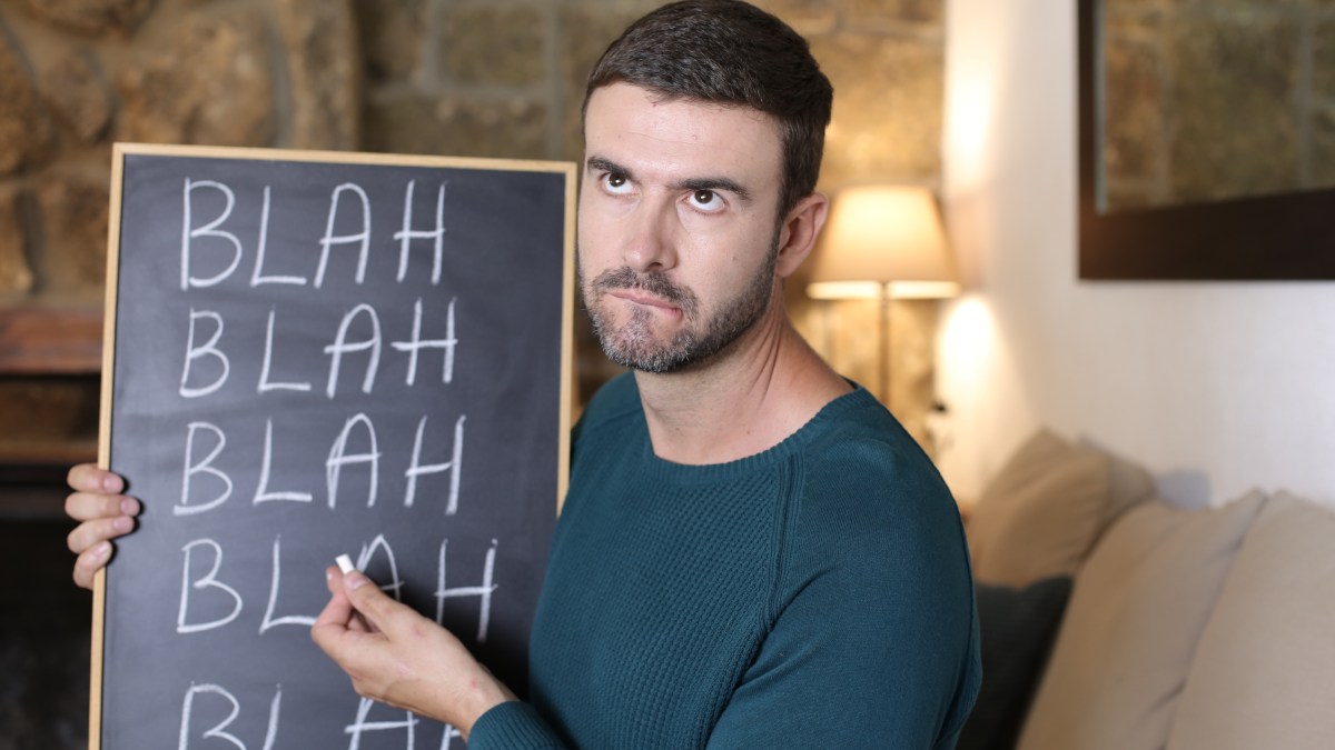 Man holding blackboard
