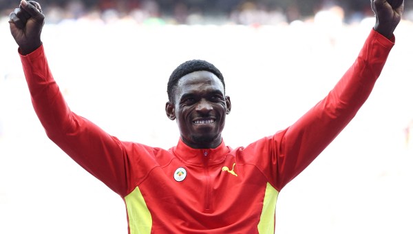 Bronze medallist Grenada's Lindon Victor celebrates on the podium during the victory ceremony for the men's decathlon athletics event during the Paris 2024 Olympic Games at Stade de France