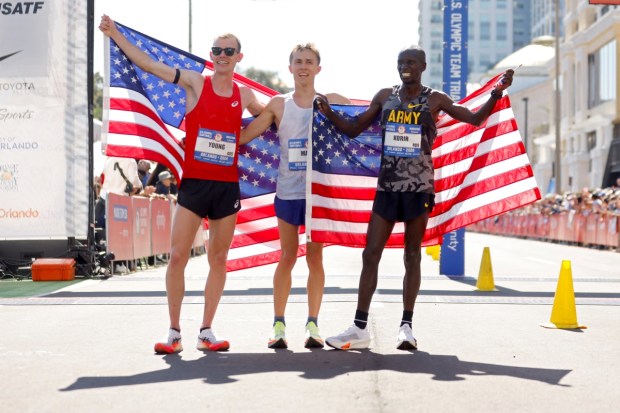 Clayton Young, Conner Mantz, and Leonard Korir pose for photos after Mantz won the 2024 U.S. Olympic Team Trials