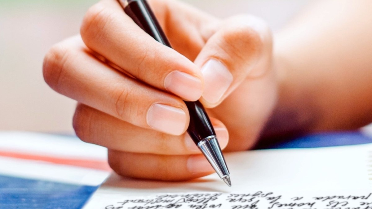 Handwriting a letter closeup