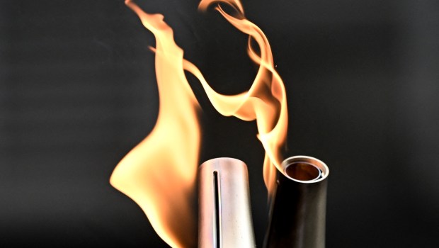 Two Olympic torches in Paris Olympics relay