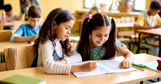 Two young students studying together