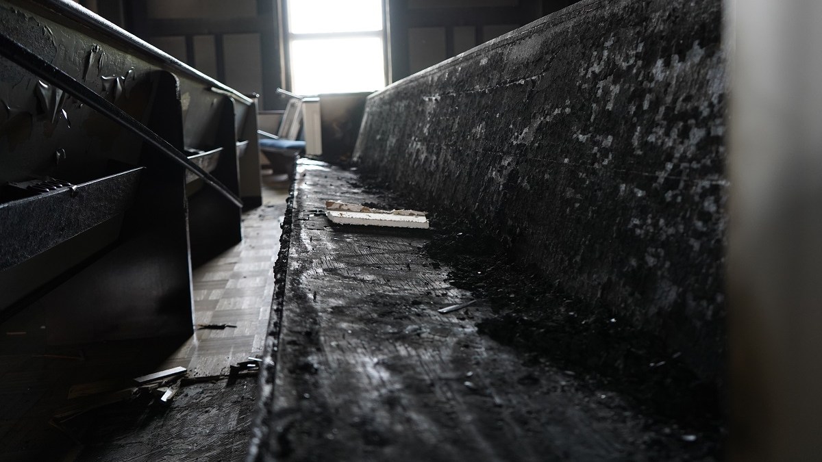 burned church pew