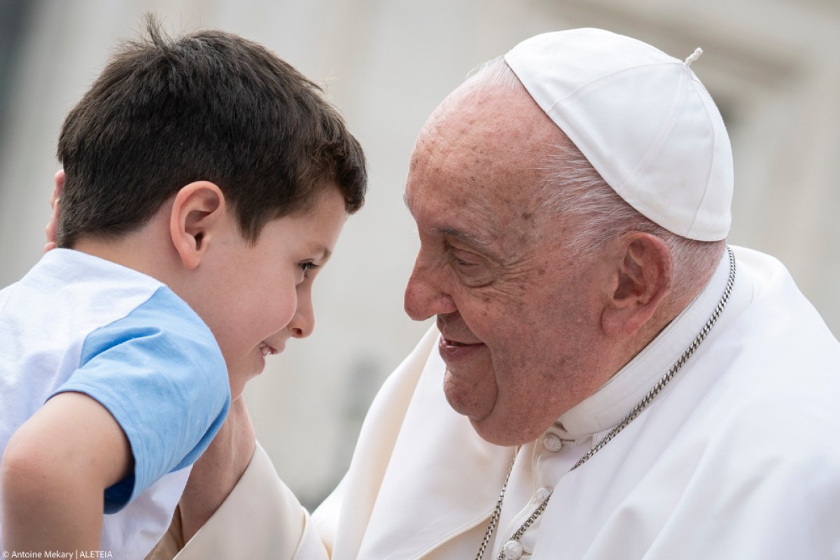 Pope Francis greets a boy at the end of the weekly general audience on September 18, 2024 at St Peter's square in The Vatican.