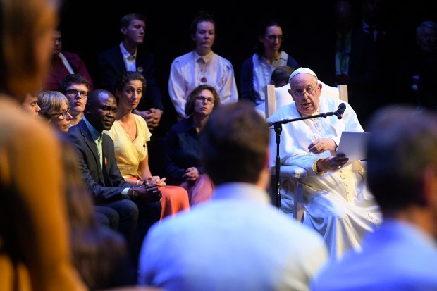 Pope Francis (R) attending a meeting with students and members of the Catholic University of Louvain in Louvain-la-Neuve. The pope is on a four-day apostolic journey to Luxembourg and Belgium.