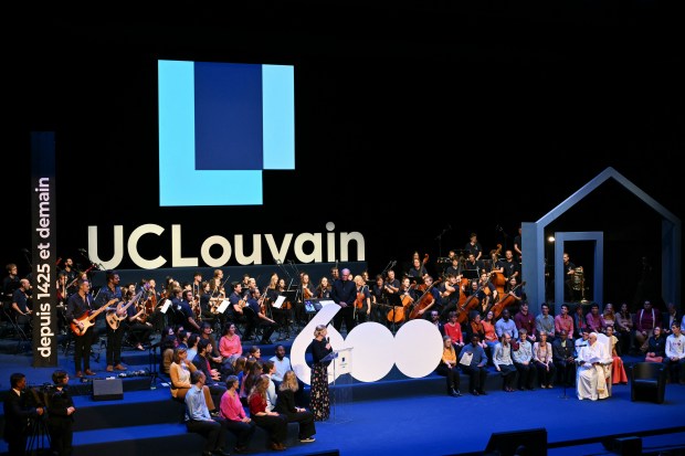 Pope Francis (R) attends a meeting with students and members of the Catholic University of Louvain at the Aula Magna in Louvain-la-Neuve on September 28, 2024.