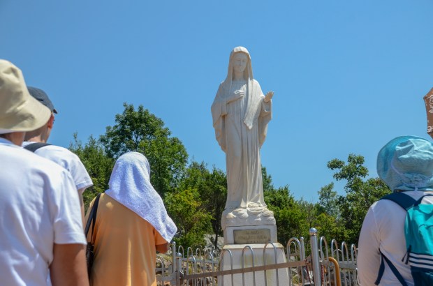 Pilgrims-in-Medjugorje-Statue-of-Virgin-Mary