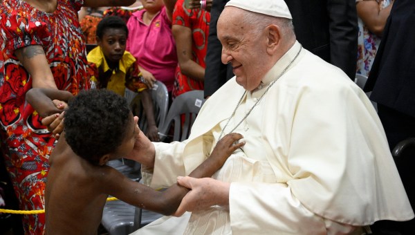 Pope Francis greets a child as he visits Children of Street Ministry and Callan Services at the Caritas Technical Secondary School in Port Moresby on September 7, 2024.