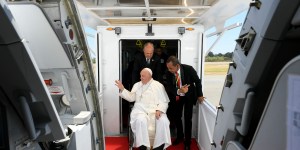 Does the pope fly first class on his trips? 
