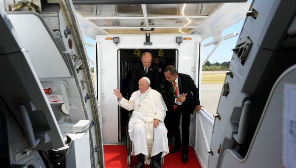 Pope Francis preparing to board a plane at Presidente Nicolau Lobato International Airport in Dili before departing for Singapore.